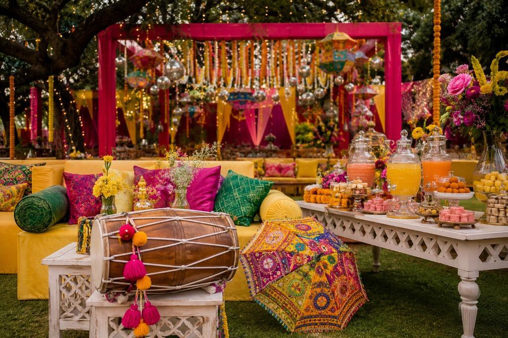 Dance and dhol inspired Mehndi and Sangeet stage decoration