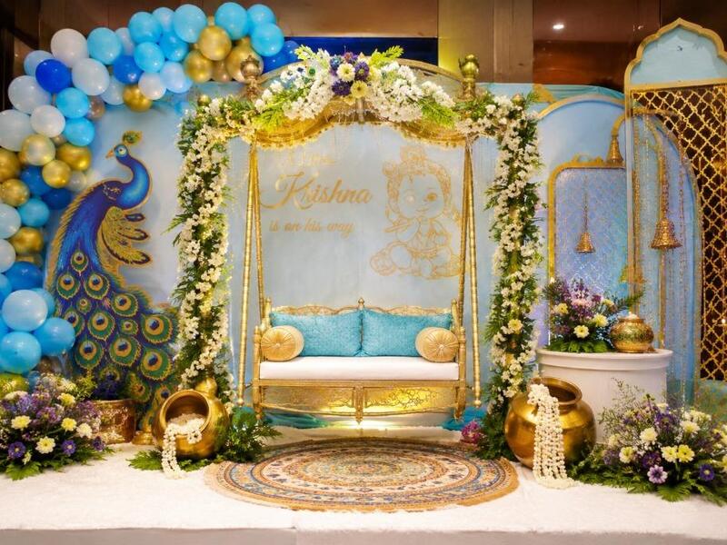 Little Krishna baby shower decoration with floral themed backdrop